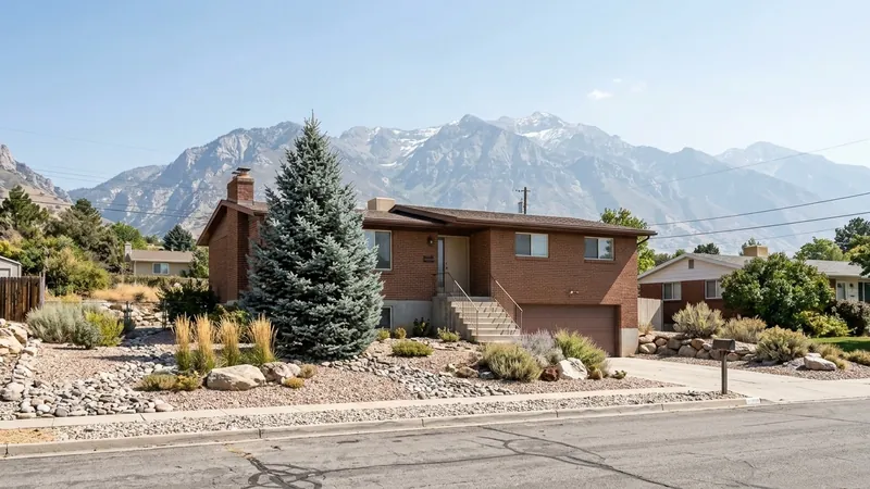 Brick bi-level with mountains behind, the kind of home where we offer tankless water heater repair in Timnath, CO